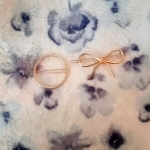 Two gold hair clips